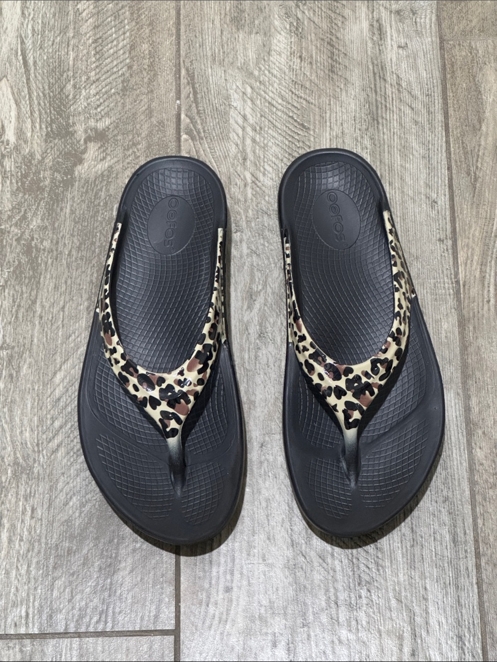 OOFOS Black Flip Flops with Leopard Print Straps